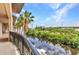 Balcony view of the serene waterway lined with lush greenery and palm trees at 900 E Marion Ave # 1403, Punta Gorda, FL 33950