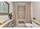 Bathroom featuring a tub with shower, vanity, commode, and decorative accessories at 900 E Marion Ave # 1403, Punta Gorda, FL 33950