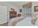 Cozy bedroom featuring a wood floor, a view from the window, and natural light at 900 E Marion Ave # 1403, Punta Gorda, FL 33950