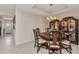 Well lit dining room features a decorative hutch and a charming light fixture at 900 E Marion Ave # 1403, Punta Gorda, FL 33950