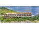 Stunning waterfront condo building featuring boat docks, water views, and lush landscaping at 900 E Marion Ave # 1403, Punta Gorda, FL 33950