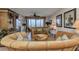 Comfortable living room with stylish furnishings and sliding glass doors offering picturesque views at 900 E Marion Ave # 1403, Punta Gorda, FL 33950