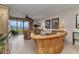 Cozy living room with tile floors and sliding doors that showcase water views at 900 E Marion Ave # 1403, Punta Gorda, FL 33950