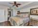 Well-appointed main bedroom featuring a ceiling fan, hardwood floors, and a scenic window at 900 E Marion Ave # 1403, Punta Gorda, FL 33950