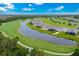 Aerial view of backyard of home on golf course with pool overlooking the pond at 14846 Contenta Loop, Bradenton, FL 34211