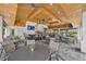 The bar has wood ceilings, pendant lighting, a bar with chairs and tables with chairs for patrons at 14846 Contenta Loop, Bradenton, FL 34211