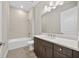 Well-lit bathroom showcasing a tiled shower-tub combo, and stylish vanity with sleek fixtures at 14846 Contenta Loop, Bradenton, FL 34211