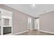 Bedroom with crown molding, wood-look floors, and access to a closet and bathroom at 14846 Contenta Loop, Bradenton, FL 34211