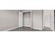 Cozy bedroom featuring wood-look floors, closet, and convenient access to adjacent rooms at 14846 Contenta Loop, Bradenton, FL 34211