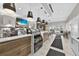 Modern cafe with coffee bar, display cases, pendant lighting, television, wood accents and tile floors at 14846 Contenta Loop, Bradenton, FL 34211