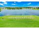 Scenic aerial view of the driving range over looking a lake at 14846 Contenta Loop, Bradenton, FL 34211
