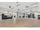 Large fitness center with weights, exercise equipment, mirrors, and ceiling fans in a spacious and well-lit area at 14846 Contenta Loop, Bradenton, FL 34211