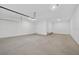 Spacious two-car garage featuring high ceilings and ample room for parking and storage at 14846 Contenta Loop, Bradenton, FL 34211