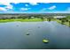 Aerial view of multiple greens resting in a lake at 14846 Contenta Loop, Bradenton, FL 34211