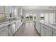 Modern eat-in kitchen with marble countertops, gray subway tile backsplash, and stainless appliances at 14846 Contenta Loop, Bradenton, FL 34211
