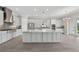 Spacious kitchen featuring a large island, stainless steel appliances, and modern finishes at 14846 Contenta Loop, Bradenton, FL 34211