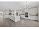 Bright kitchen featuring an oversized island, stainless steel appliances, and modern finishes at 14846 Contenta Loop, Bradenton, FL 34211