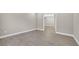 Spacious living room featuring wood-look floors and stylish lighting at 14846 Contenta Loop, Bradenton, FL 34211