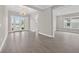 Spacious living room with tile flooring and large windows allowing for natural light at 14846 Contenta Loop, Bradenton, FL 34211
