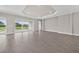 Open-concept living area features a tile floor, with access to the lanai with stunning water views at 14846 Contenta Loop, Bradenton, FL 34211