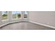Bright living room with wood-look floors and large windows offering plenty of natural light at 14846 Contenta Loop, Bradenton, FL 34211