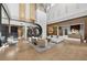 An elegant lobby with high ceilings, modern decor, stylish seating, and herringbone wood floors at 14846 Contenta Loop, Bradenton, FL 34211