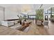 Inviting lounge area with modern decor, a light fixture, and plenty of seating near the windows at 14846 Contenta Loop, Bradenton, FL 34211