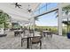 Open-concept restaurant with a view of the golf course, neutral color palette, and ceiling fans at 14846 Contenta Loop, Bradenton, FL 34211