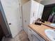 Bathroom vanity with storage and a tile floor at 15090 Rebecca Ave, Port Charlotte, FL 33953