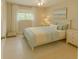 Bedroom with a ceiling fan, a double bed, and a light blue color scheme at 15090 Rebecca Ave, Port Charlotte, FL 33953
