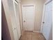 Hallway with several doors at 15090 Rebecca Ave, Port Charlotte, FL 33953
