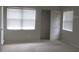 Bedroom with neutral walls, carpet flooring, and natural lighting at 429 Cerromar Ln # 353, Venice, FL 34293