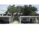 Low-rise condos with mature landscaping and covered parking spaces at 429 Cerromar Ln # 353, Venice, FL 34293