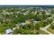 View of the home, highlighting the pool and yard, with a peaceful neighborhood setting at 732 Haleybury St, Port Charlotte, FL 33948