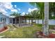 Image showcasing a backyard with an above-ground pool, pergola, and a cozy swing at 732 Haleybury St, Port Charlotte, FL 33948