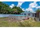 Spacious backyard with an above-ground pool, perfect for outdoor recreation and relaxation at 732 Haleybury St, Port Charlotte, FL 33948
