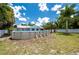 A large backyard with an above ground swimming pool for hot days at 732 Haleybury St, Port Charlotte, FL 33948