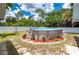 The backyard features an above-ground swimming pool surrounded by a well-maintained lawn at 732 Haleybury St, Port Charlotte, FL 33948