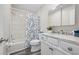 Neat bathroom with tub, shower, white marble countertop, and a vanity at 732 Haleybury St, Port Charlotte, FL 33948