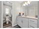 Well-lit bathroom showcasing a vanity, walk-in shower, and modern toilet at 732 Haleybury St, Port Charlotte, FL 33948