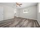 Spacious bedroom with ceiling fan, window, and en-suite bathroom access at 732 Haleybury St, Port Charlotte, FL 33948