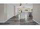 Stylish kitchen with a gray island, stainless steel appliances, and wood-look flooring at 732 Haleybury St, Port Charlotte, FL 33948