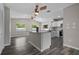 Modern kitchen featuring a center island, stainless appliances, and sleek cabinets at 732 Haleybury St, Port Charlotte, FL 33948