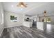 Open concept living area with views into the modern kitchen and dining area at 732 Haleybury St, Port Charlotte, FL 33948