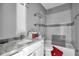 Bathroom with new subway-style tile in the shower, a marble sink, and a toilet at 7696 Plantation Cir, Bradenton, FL 34201