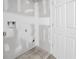 Unfinished laundry room features tile flooring, drywall and plumbing for the laundry machine at 7696 Plantation Cir, Bradenton, FL 34201