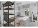 Open-concept renovation featuring gray tile flooring and modern shutters at 7696 Plantation Cir, Bradenton, FL 34201