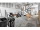 Spacious living room undergoing renovations, featuring stairs, and ample natural light at 7696 Plantation Cir, Bradenton, FL 34201