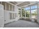 Unfinished sun room features several windows and natural light at 7696 Plantation Cir, Bradenton, FL 34201