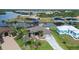 Lovely waterfront home with lush landscaping, private dock and decorative driveway at 8178 Arlewood Cir, Port Charlotte, FL 33981